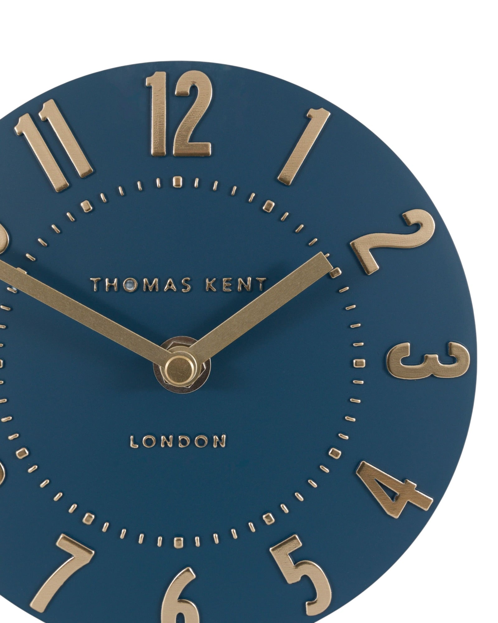 Thomas Kent Mulberry mantle clock in midnight blue with white clock face and black hands, decorative wood frame.