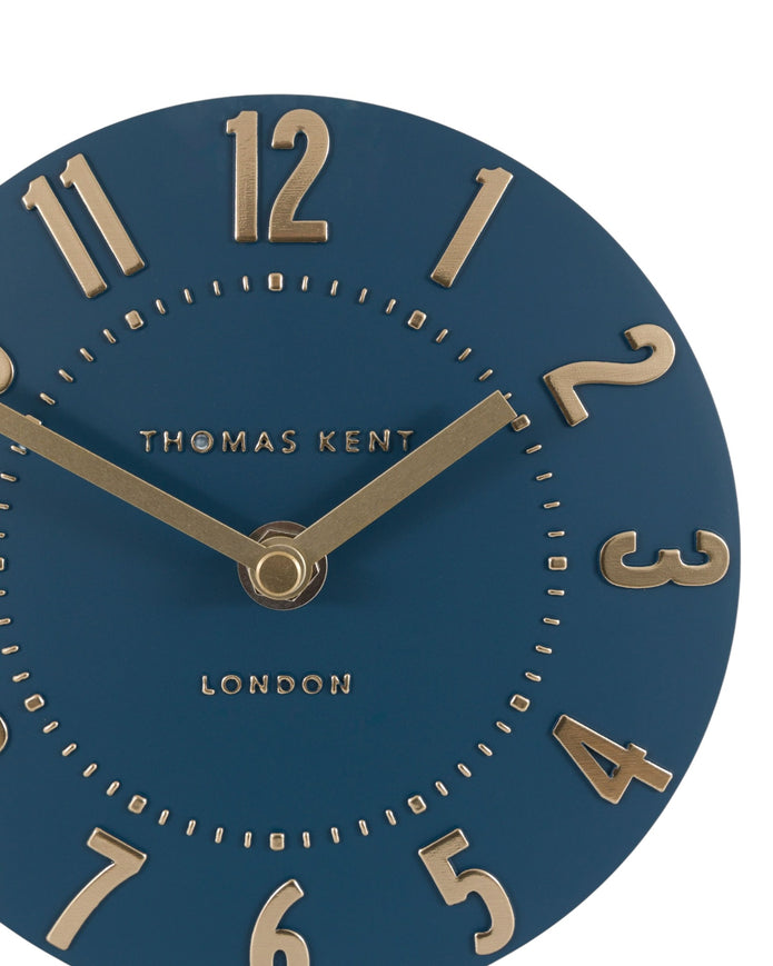 Thomas Kent Mulberry mantle clock in midnight blue with white clock face and black hands, decorative wood frame.