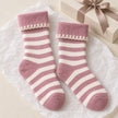 Super Cosy Fluffy Cuff Socks - Pink Stripe, pink and cream striped socks beside a wrapped gift