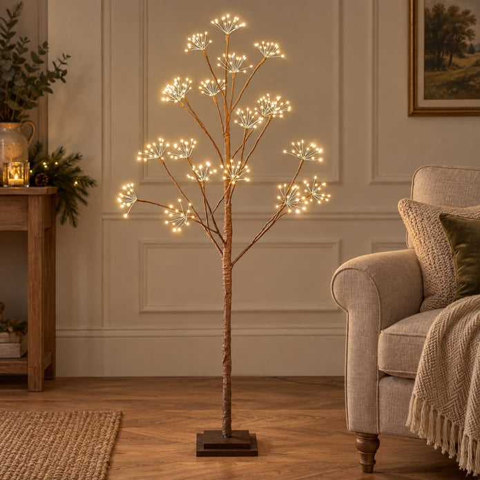 Lightstyle London LED Woodland Christmas tree with glowing lights and woodland-themed decorations on a festive display.