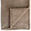 Beige Luxury Snuggle Blanket Throw, close-up of the beige fabric and stitched edge