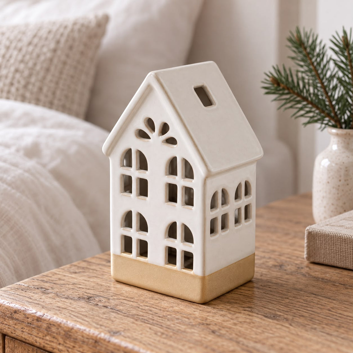 White ceramic LED light-up house for home decor by Sifcon, illuminated ceramic figure with detailed windows and roof.