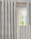 Riva Home Yard Natural striped blackout eyelet curtains in black and white fabric hanging with eyelet top design