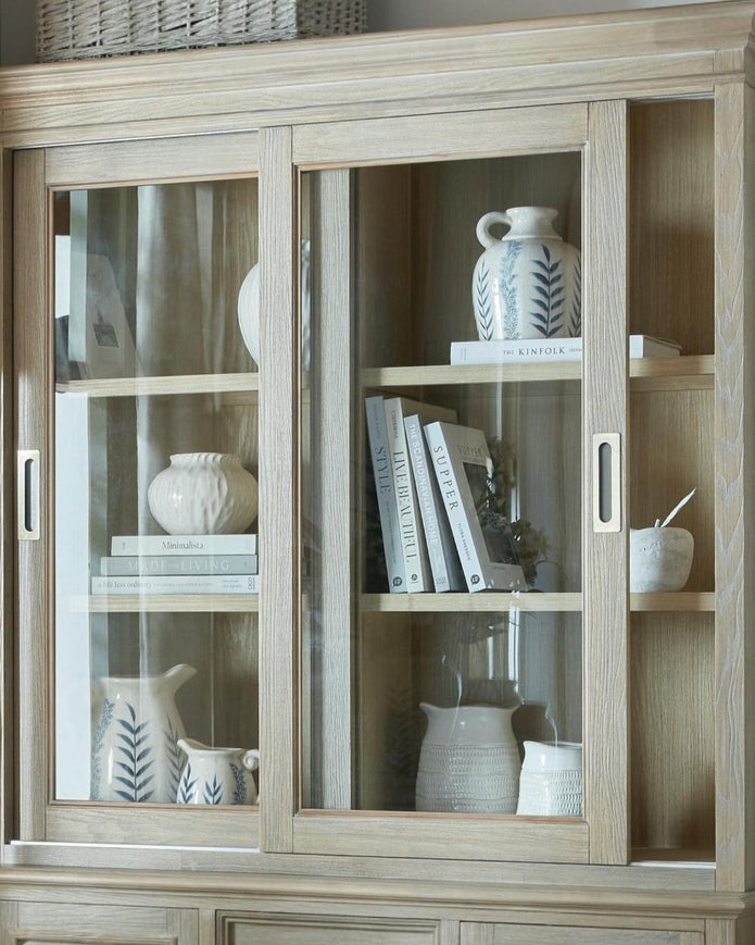 Delphine Collection sliding glass dresser top by Hill Interiors, showcasing sleek glass surface and modern furniture design.