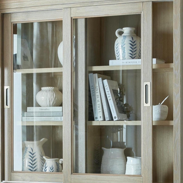 Delphine Collection sliding glass dresser top by Hill Interiors, showcasing sleek glass surface and modern furniture design.