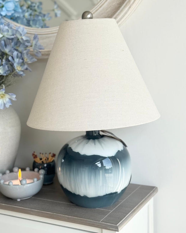 Teal blue glass lamp from Hill Interiors, decorative lighting fixture with elegant glass design and modern style.