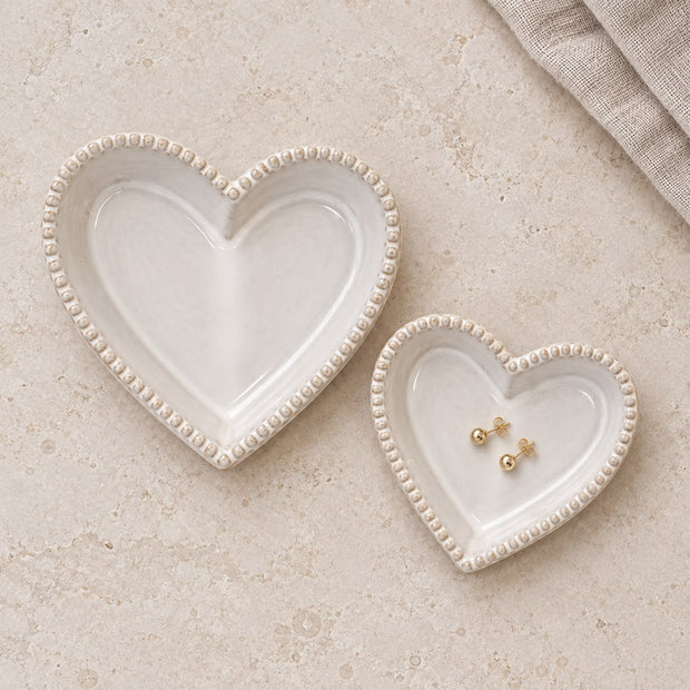 Natural Ceramic Heart Shaped Plate With Bobble Rim, two cream heart-shaped dishes, one holding small jewellery