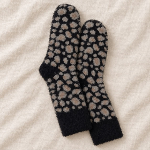 Black Fluffy Leopard Print Socks, black leopard socks arranged on cream linen
