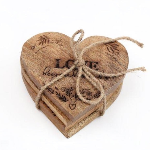Heart Shaped Wooden Coasters - Set of Four, heart-shaped wooden coasters tied with twine against white