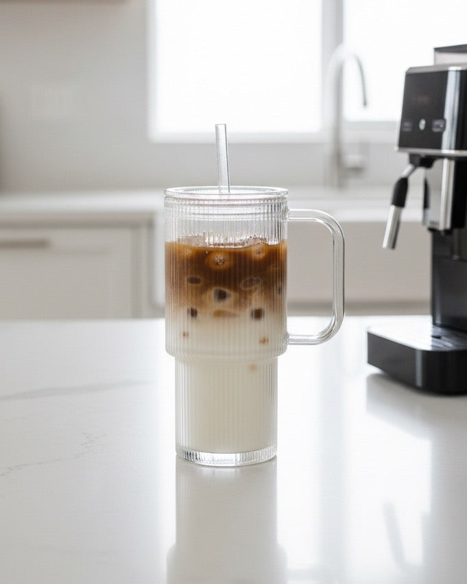 Glass ribbed Stanley-style iced coffee travel cup by Starlight Express, featuring a clear design with a lid for on-the-go drinking.