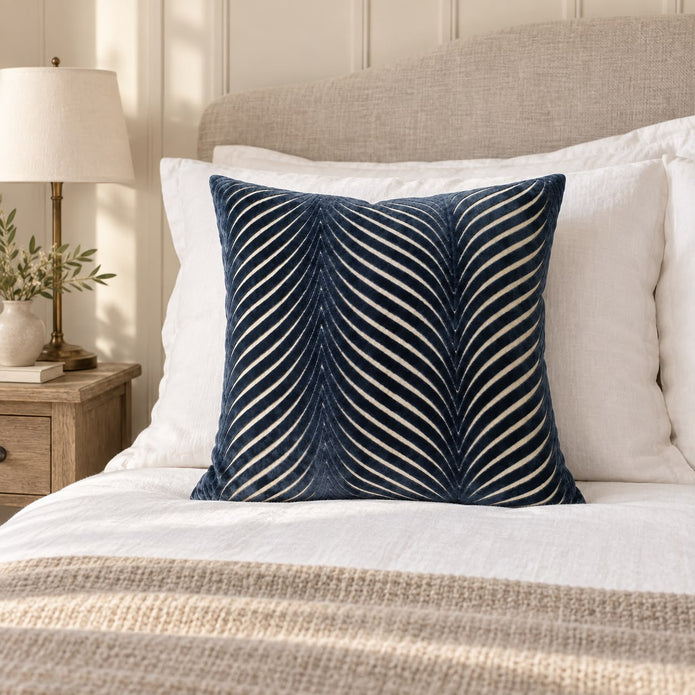 Navy Blue Cut Velvet Fan Cushion Cover, navy fan-patterned cushion against white pillows on a bed