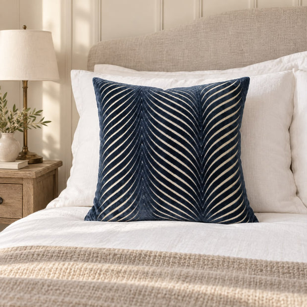 Navy Blue Cut Velvet Fan Cushion Cover, navy fan-patterned cushion against white pillows on a bed
