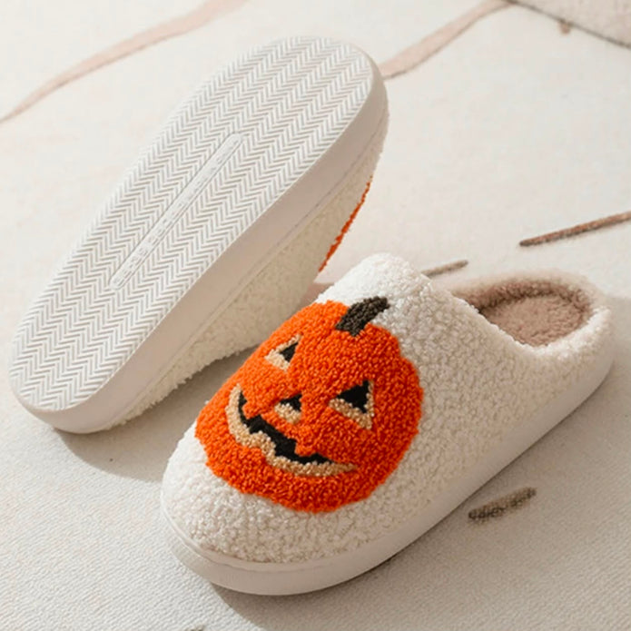 Pumpkin Slippers, pumpkin slipper beside a turned-over slipper showing the sole