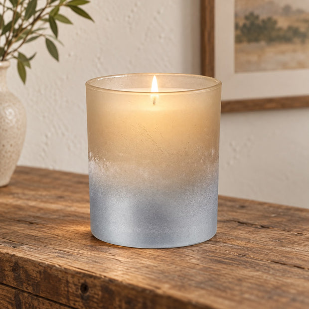 Faded Bronze Glass Tealight Holder, bronze and silver glass holder glowing on a wooden console