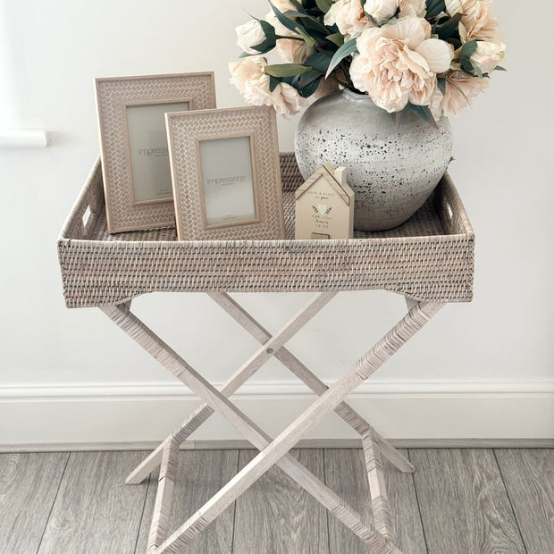 Rattan Weave Effect Frame, woven-effect frames beside a vase of flowers on a tray table