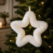 Fluffy Hanging White Star, close view of a fluffy white hanging star