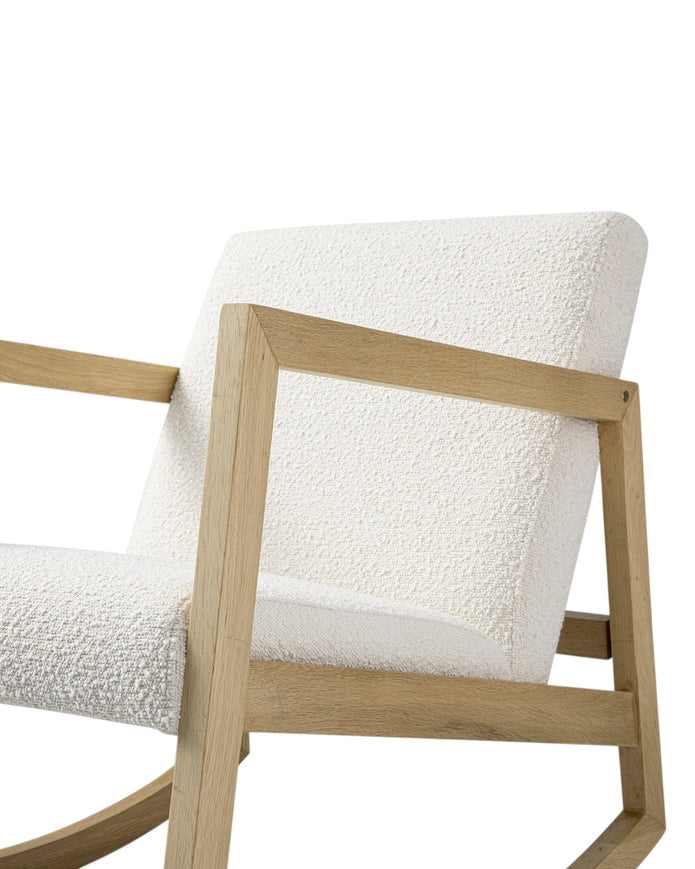Cream boucle Sherpa rocking chair from Starlight Express with plush upholstery and wooden rocking base.