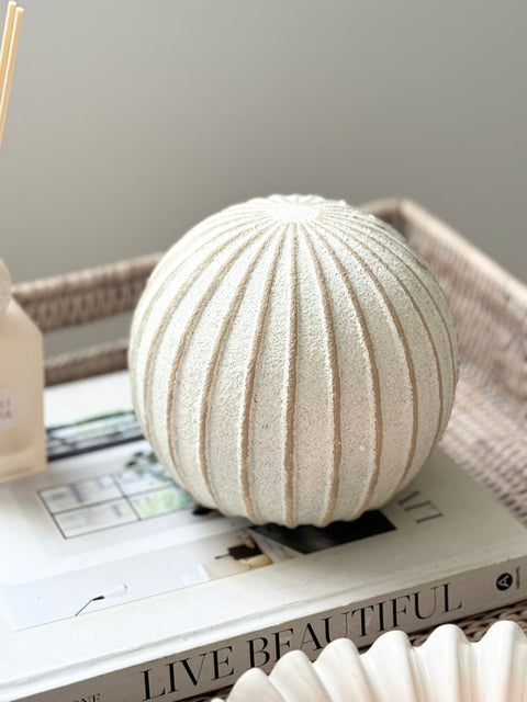Decorative striped globe ball for home décor by Hill Interiors, featuring a spherical shape with colorful stripe patterns.