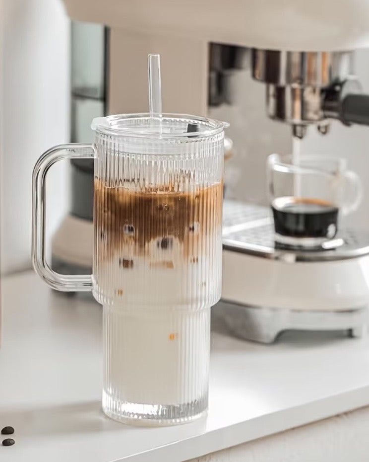 Clear glass ribbed iced coffee travel cup with a lid, featuring the Stanley style design by Starlight Express for kitchen and dining use.