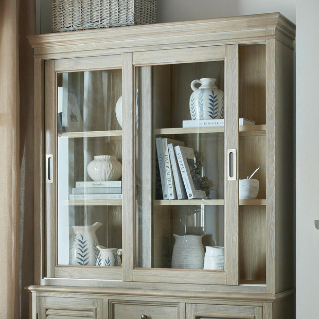 Sliding glass dresser top from Hill Interiors' Delphine Collection, showcasing clear glass panels and sleek modern design.