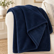 Navy Blue Luxury Snuggle Blanket Throw, close-up of the navy blue throw on a sofa arm