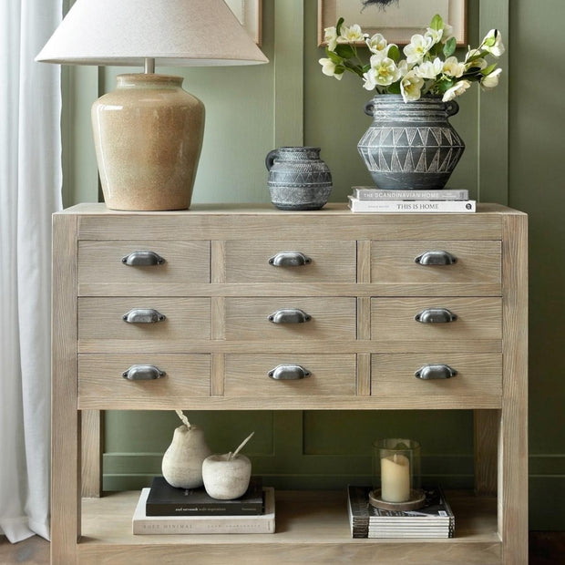 Hill Interiors Haldon Collection 9-drawer chest with top shelf, wooden furniture piece with sleek drawer handles and a modern design.