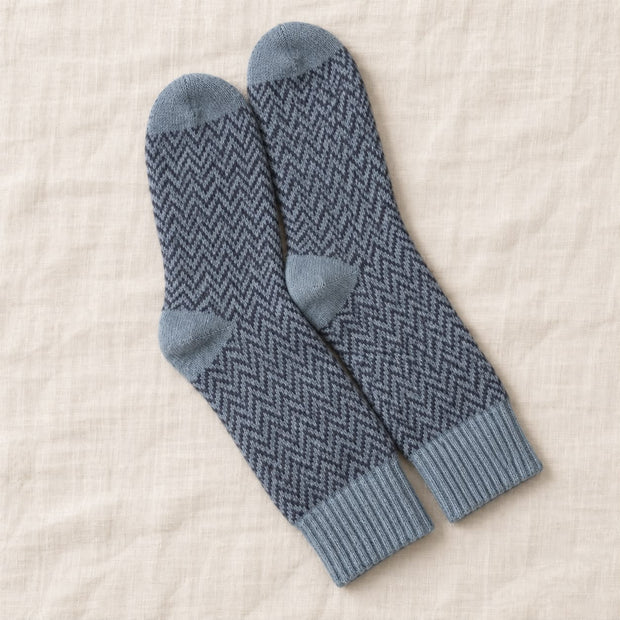 Blue Herringbone Cosy Socks, blue herringbone socks arranged on cream linen