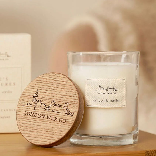 London Wax Company Lidded Candle - Amber & Vanilla, clear candle jar with its engraved wooden lid resting alongside