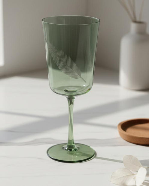 Green Palm Wine Glass, green wine glass on a kitchen counter