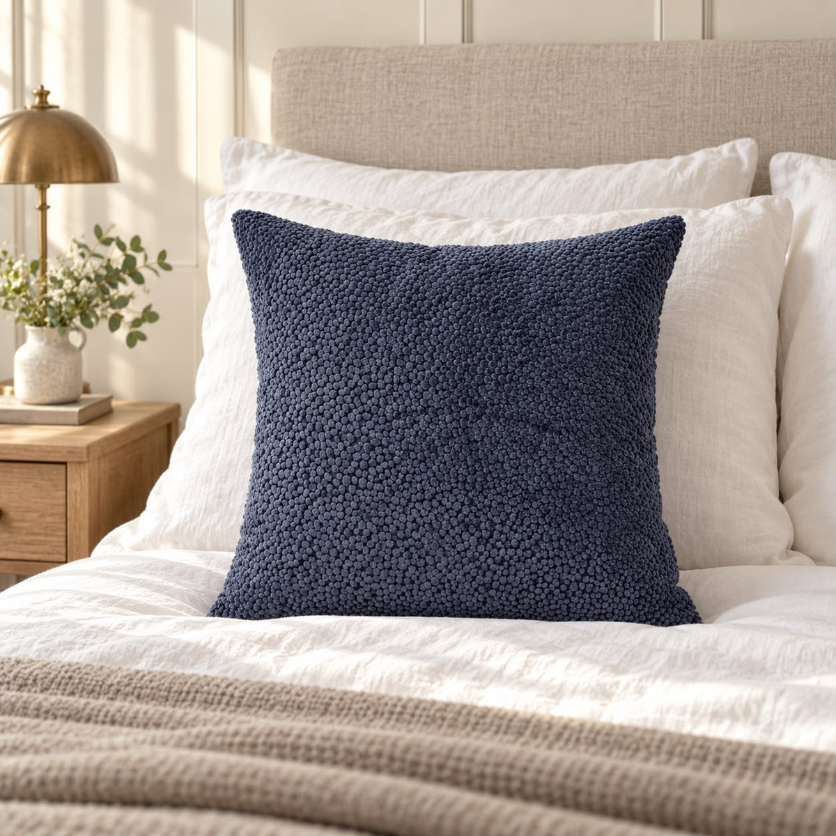 Navy Blue Velvet Bingham Cushion Cover, navy textured cushion against white pillows on a bed