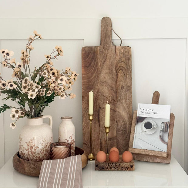 Large Wooden Footed Graze Tapas Board, wooden handled board standing behind kitchen accessories