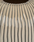 Textured beige striped vase from Hill Interiors, Pallida collection, showcasing a modern ceramic vase with subtle striped design.