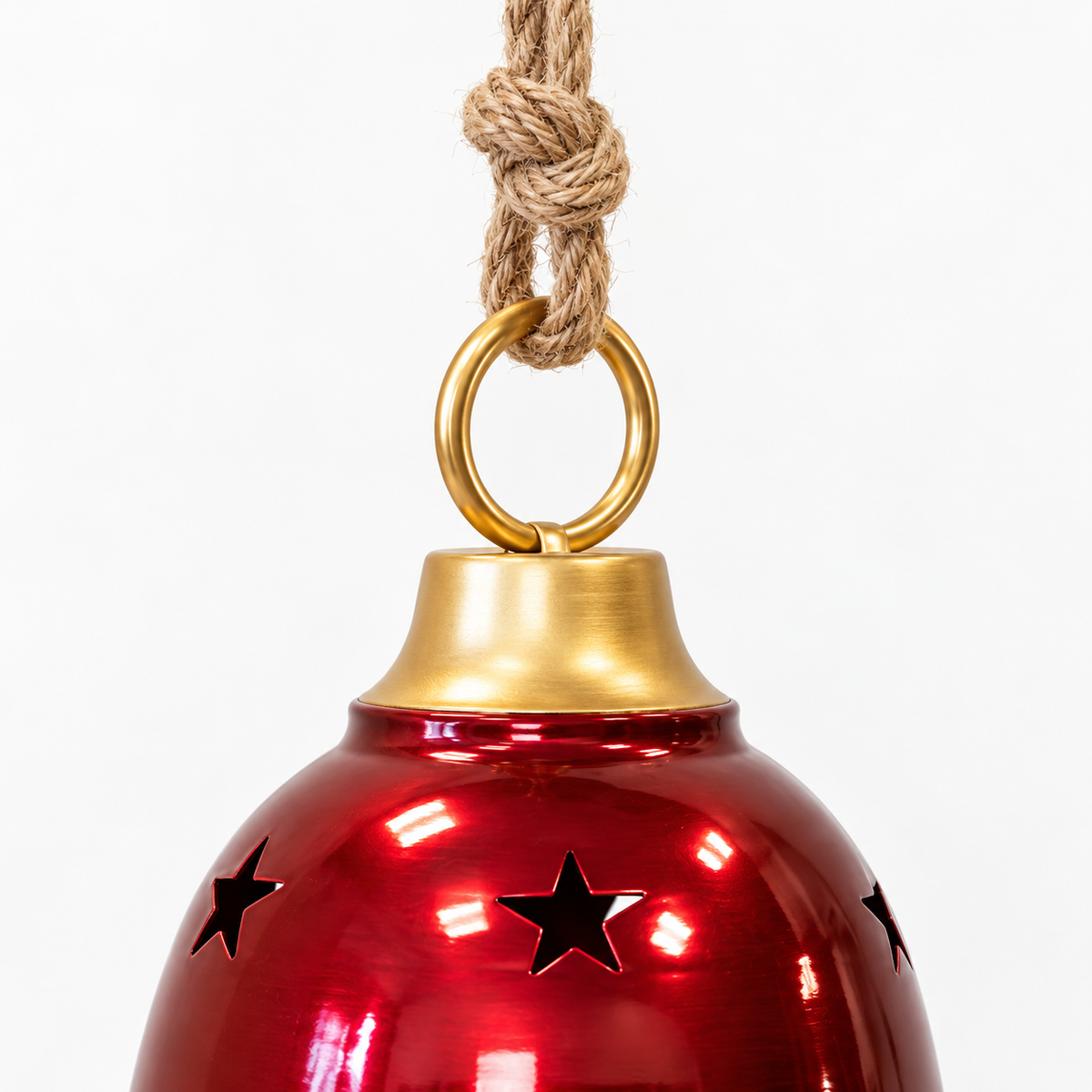 Detail of the knotted rope, gold-coloured hanging ring and cap on a burgundy metal bell