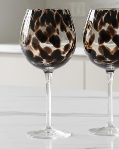 Brown Tortoise Print Wine Glasses - Set of Two, two brown mottled wine glasses on a pale surface