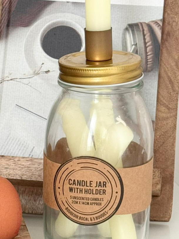 Ivory Candles In A Glass Storage Jar And Holder