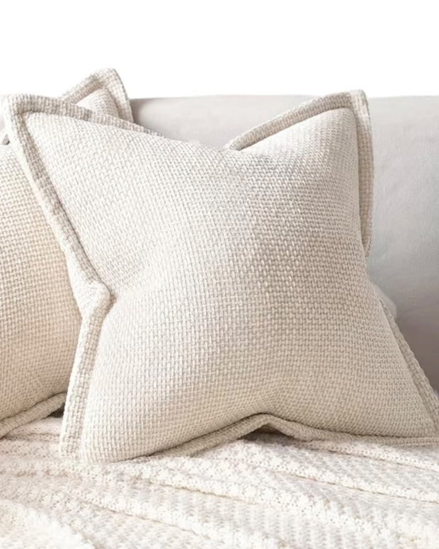 Cream woven design cushion cover from Starlight Express, soft furnishings with textured woven pattern and decorative edge.