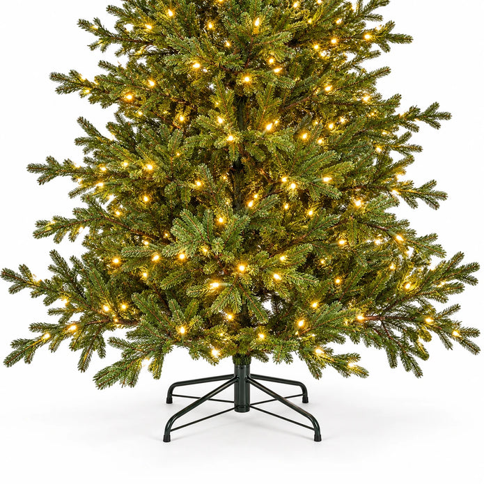 Lower green branches, warm lights and black stand of the InLit Regal KingTree Christmas tree.