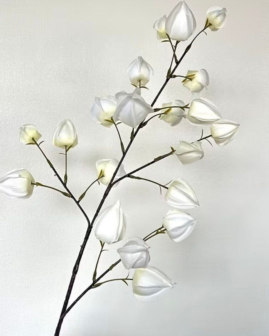 Artificial white lantern stem from Starlight Express, showcasing realistic white lantern-shaped plant with green foliage.
