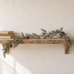 Pinecone garland along a fireplace mantel