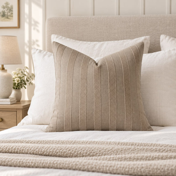 Beige Textured Stripe Velveteen Cushion Cover, beige striped cushion against white pillows on a bed