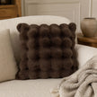 Chocolate Brown Luxury Faux Fur Cushion, brown faux fur cushion on a cream armchair