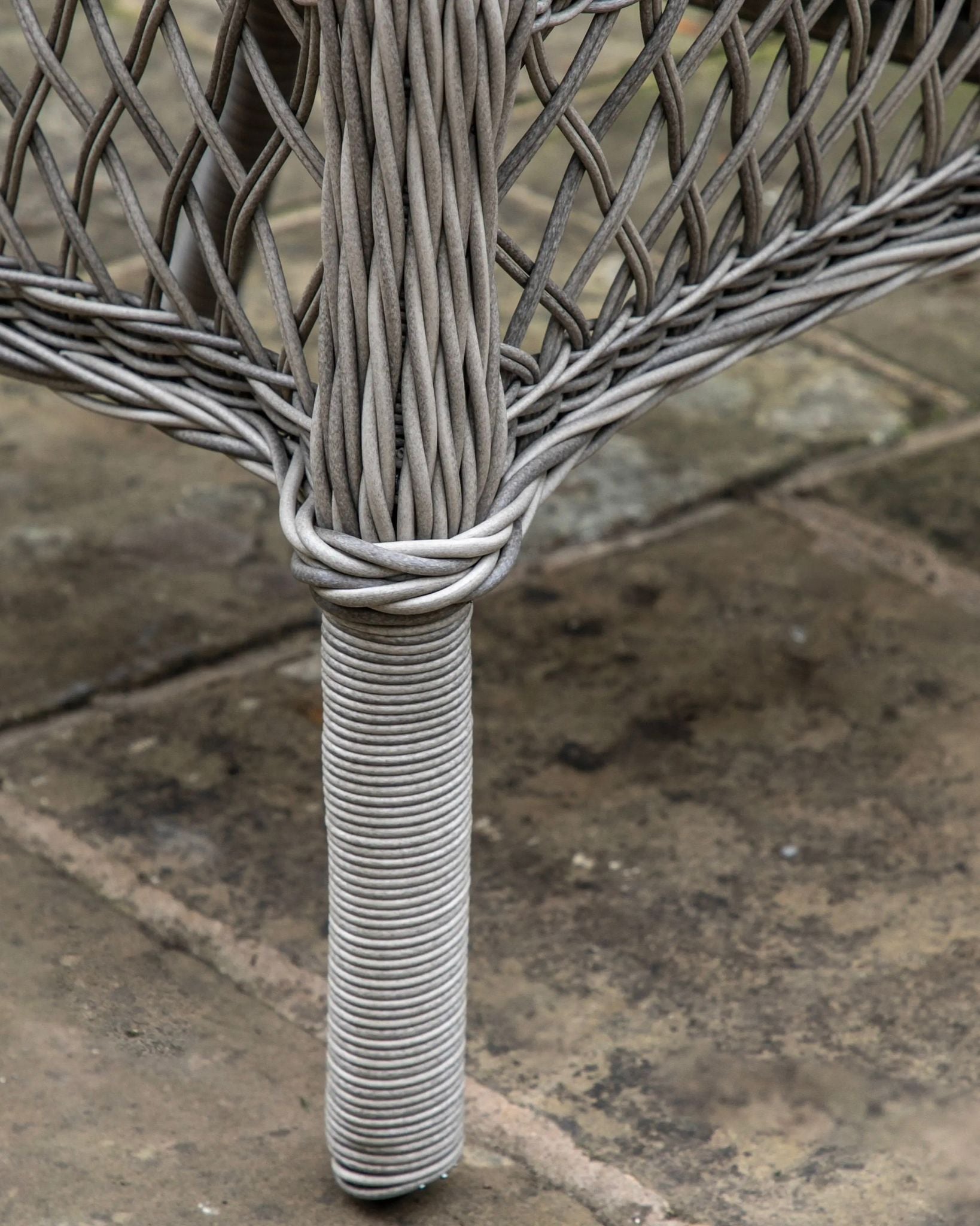 Natural rattan Menton two-seat bistro set by Gallery Direct, featuring woven rattan seats and a round table for garden seating.