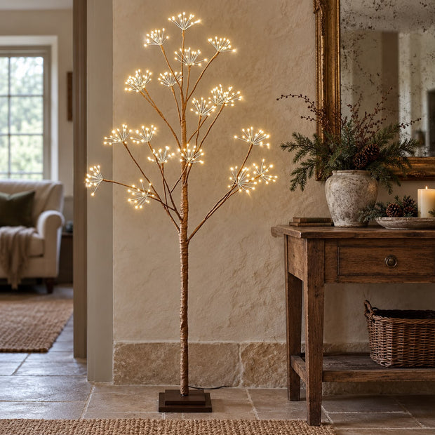 Light Up LED Woodland Tree, illuminated woodland tree beside a wooden console