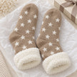 Cosy Slipper Socks - Beige Star, beige star-patterned slipper socks with fluffy cuffs beside a gift