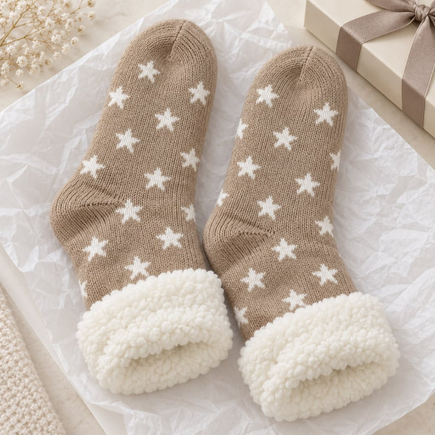 Cosy Slipper Socks - Beige Star, beige star-patterned slipper socks with fluffy cuffs beside a gift
