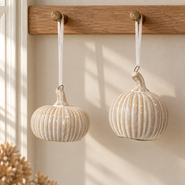 Hanging Ceramic Natural Pumpkin, two striped ceramic pumpkins hanging from wooden pegs