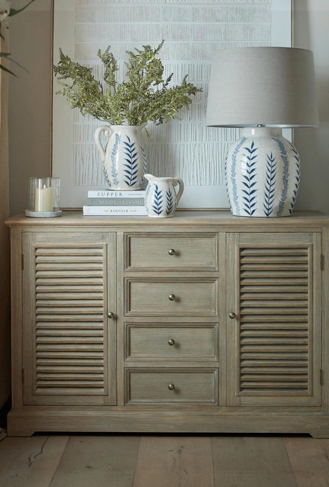 Large Hill Interiors Delphine Collection 2-door, 4-drawer dresser base with a sleek wooden finish and modern design.