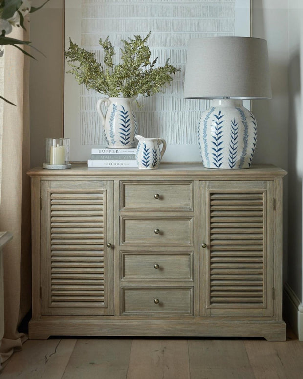 Large Hill Interiors Delphine Collection 2-door, 4-drawer dresser base with a sleek wooden finish and modern design.