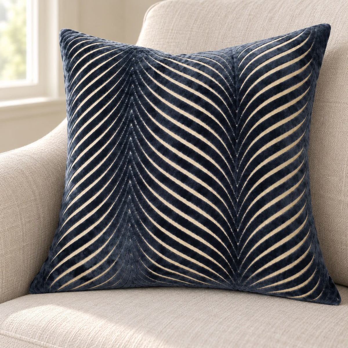 Navy Blue Cut Velvet Fan Cushion Cover, close-up of the navy cushion and curved pale lines on a sofa