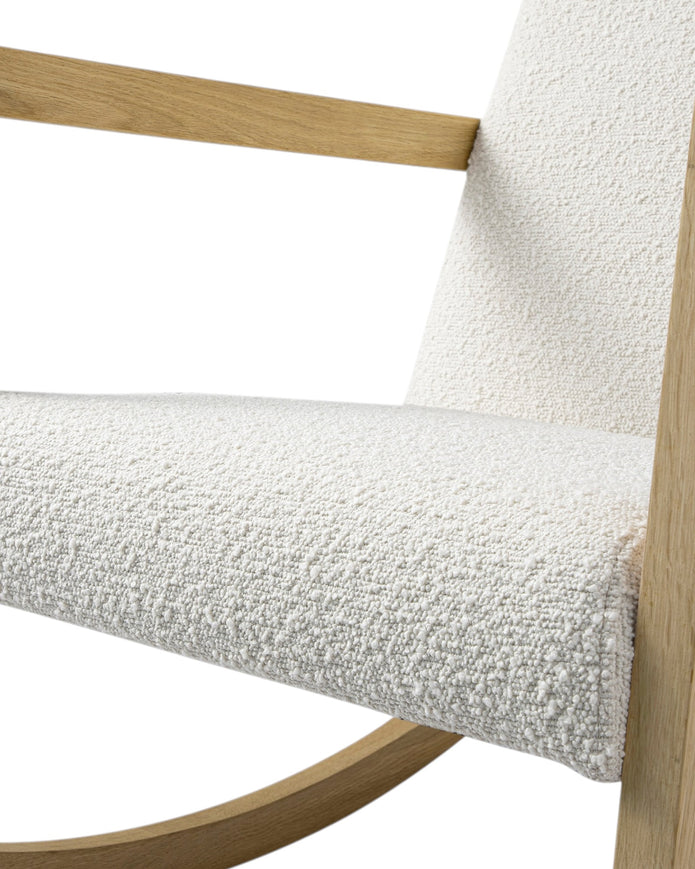 Cream boucle Sherpa rocking chair with wooden legs and plush upholstery from Starlight Express, showcasing a cozy, stylish furniture piece.